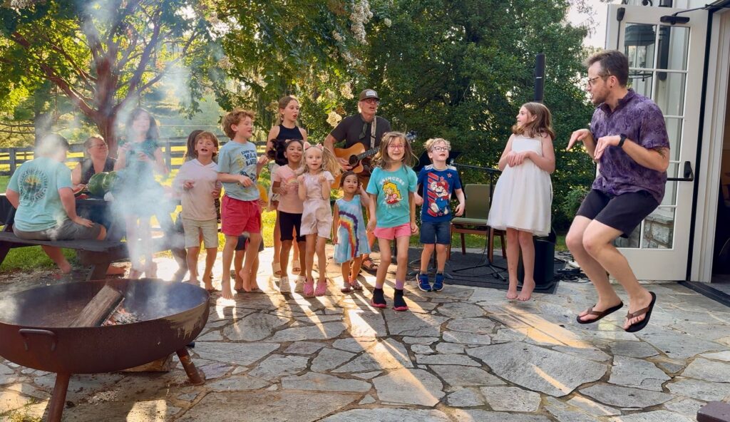 Campers from our 2025 Vacation Bible Camp jump like kangaroos as they sing Rise and Shine (the Arky Arky song)