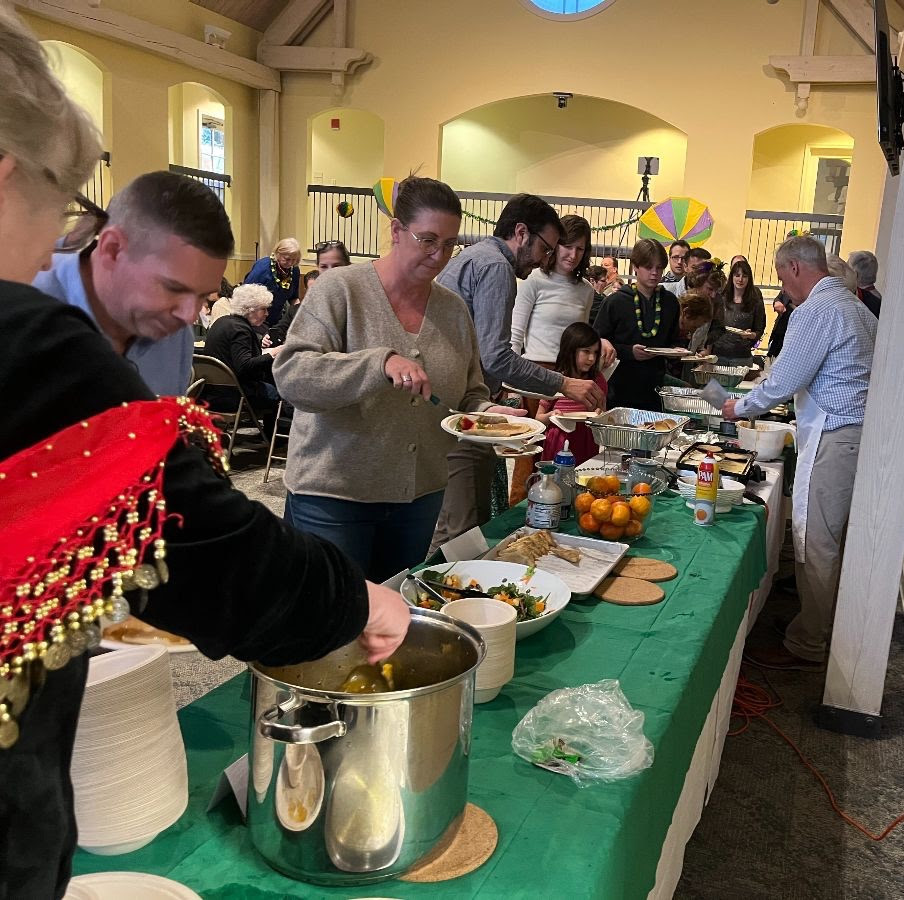 St. John's parishioners dish up pancakes and other food at the Mardi Gras on Butler celebration in 2025